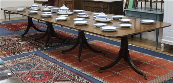 A Regency style mahogany four pillar dining table, with leaves,